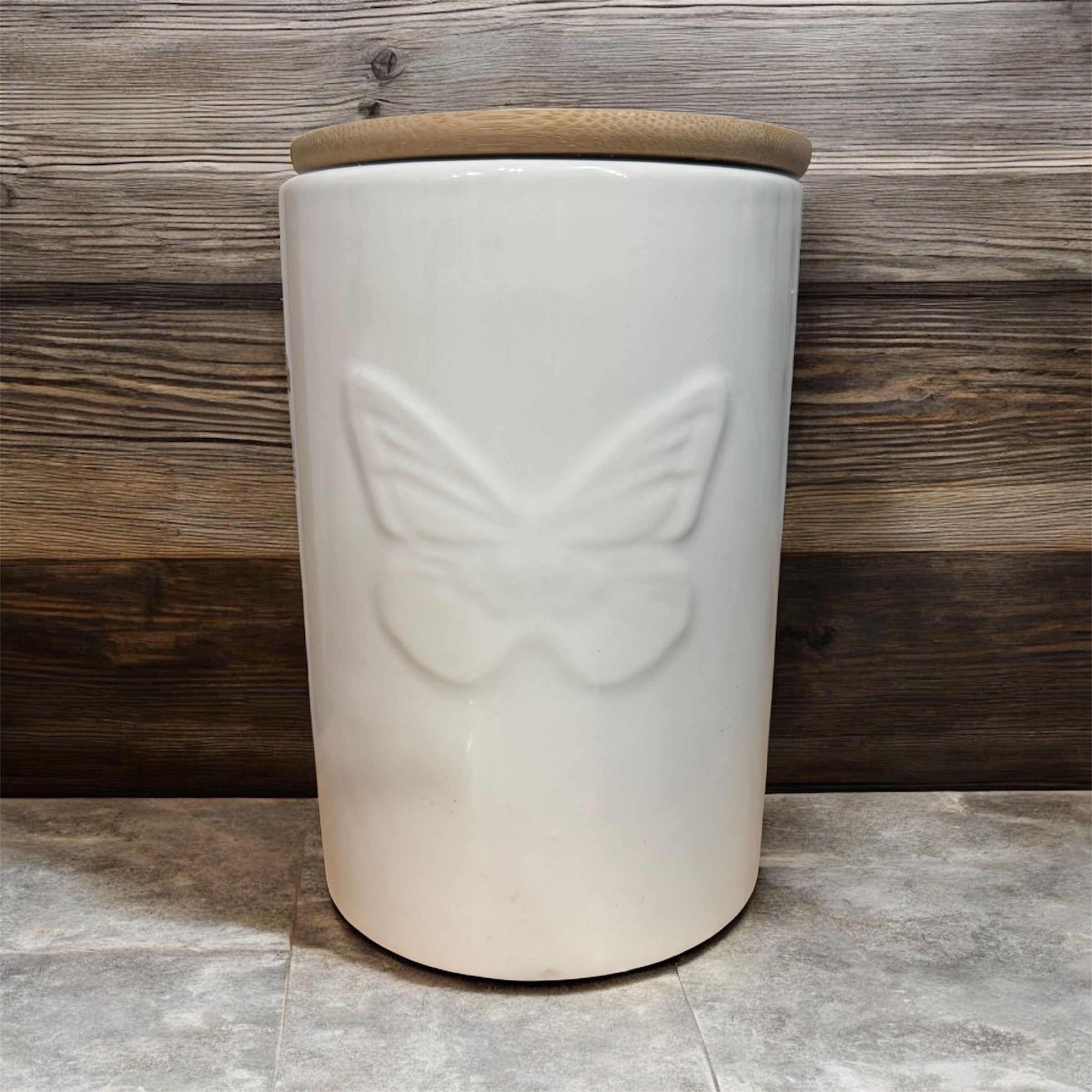 White ceramic jar with wood lid- Dolly edition with 4S Candle Co infomration label.