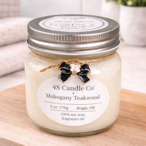 Mahogany Teakwood in mason jar with lid. String wrapped around jar wtih a bow charm attatched.