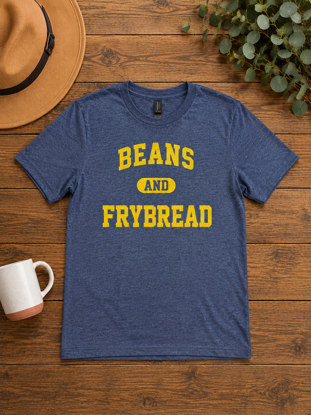 dark gray t shirt with yellow lettering that says, Beand & Frybread