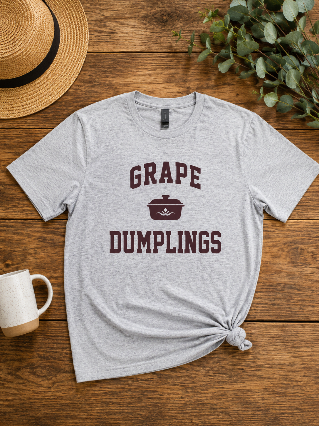 light gray t shirt with dark purple lettering that says Grape Dumpling and a graphic design
